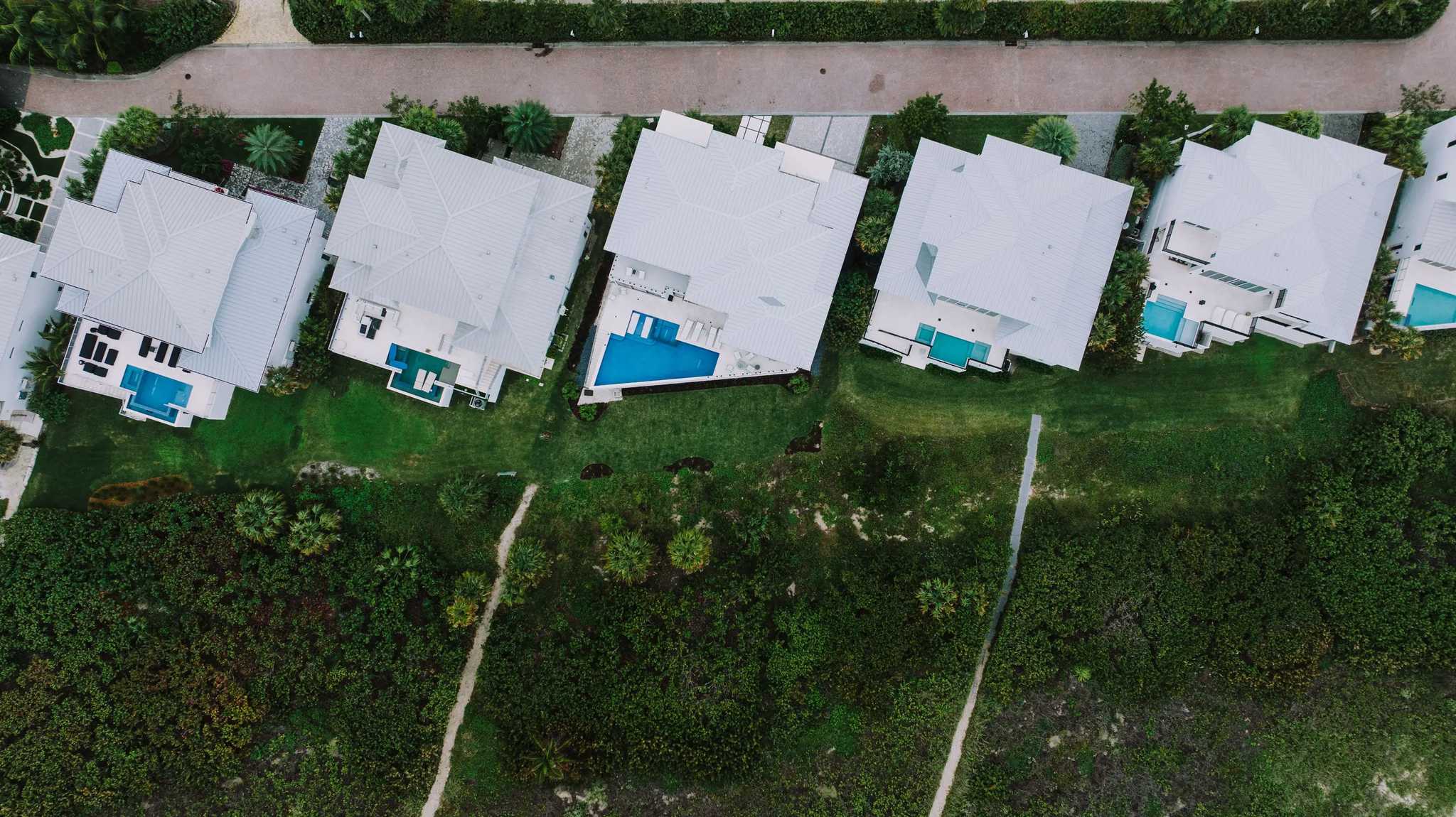 Aerial view of a suburban Florida neighborhood with pools, representative of Melbourne, FL's inland housing stock